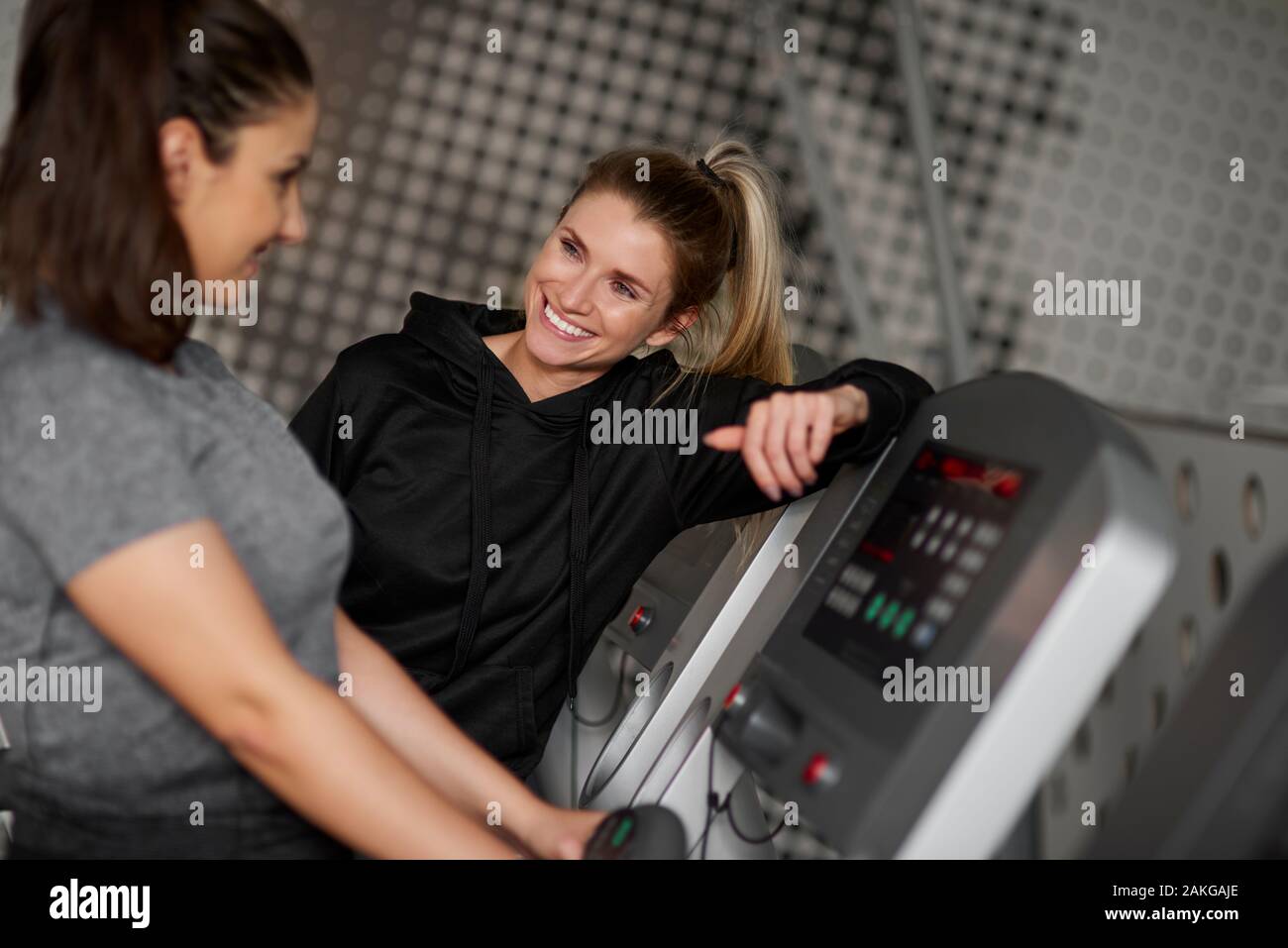 Fitness instructor and woman having a chat Stock Photo