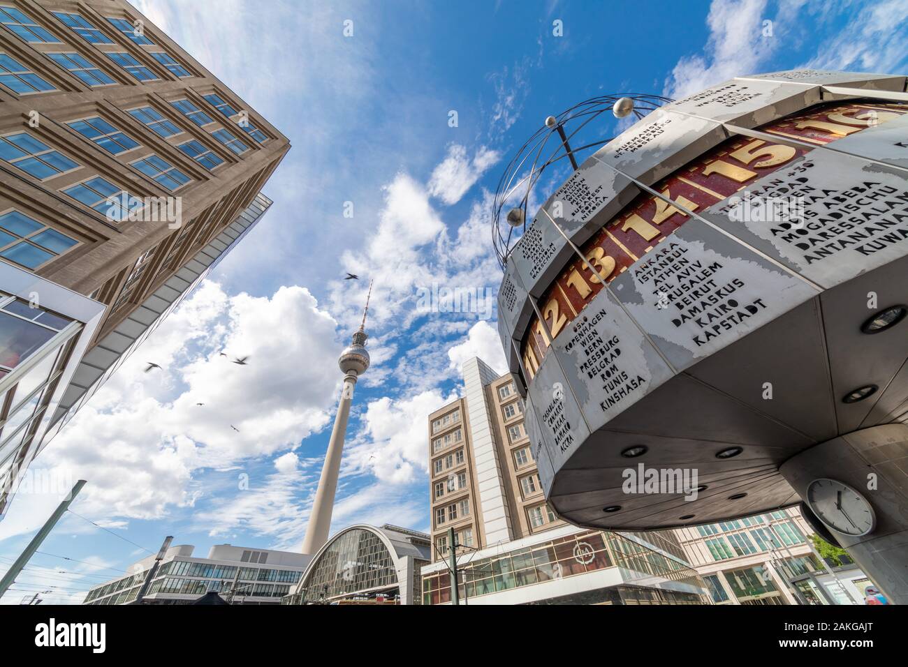 Wide angle view from below of Alexanderplatz and its attractions, with the World Clock in the foreground and the Fernsehturm in the background Stock Photo