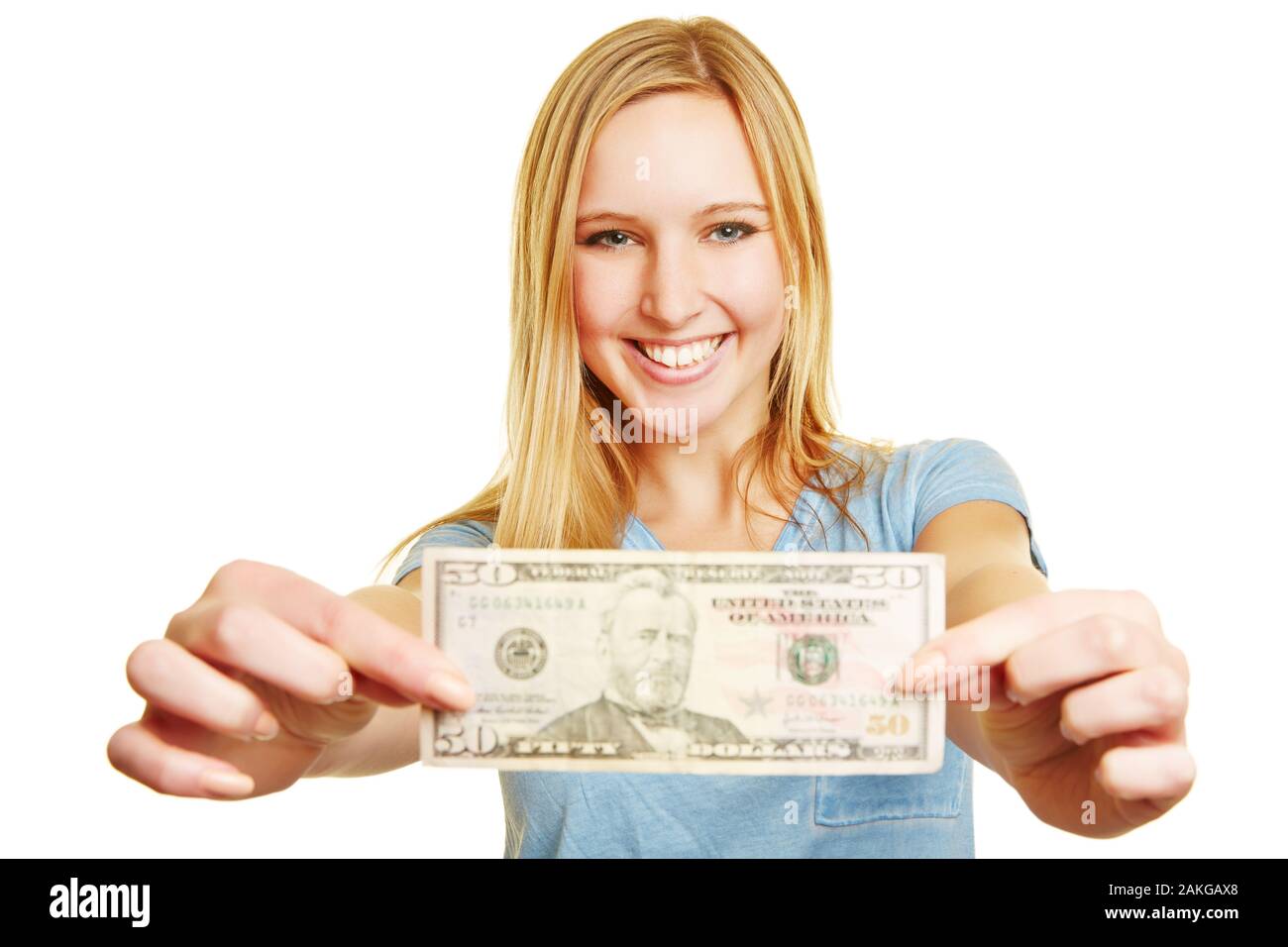 Laughing blonde woman holds a 50 dollar bill at the camera Stock Photo