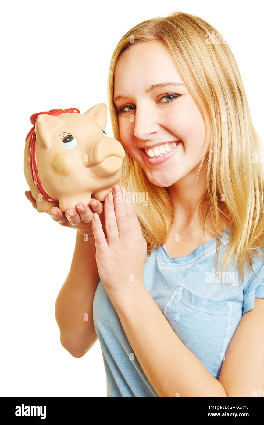 Young woman happily laughs with a big piggy bank Stock Photo - Alamy