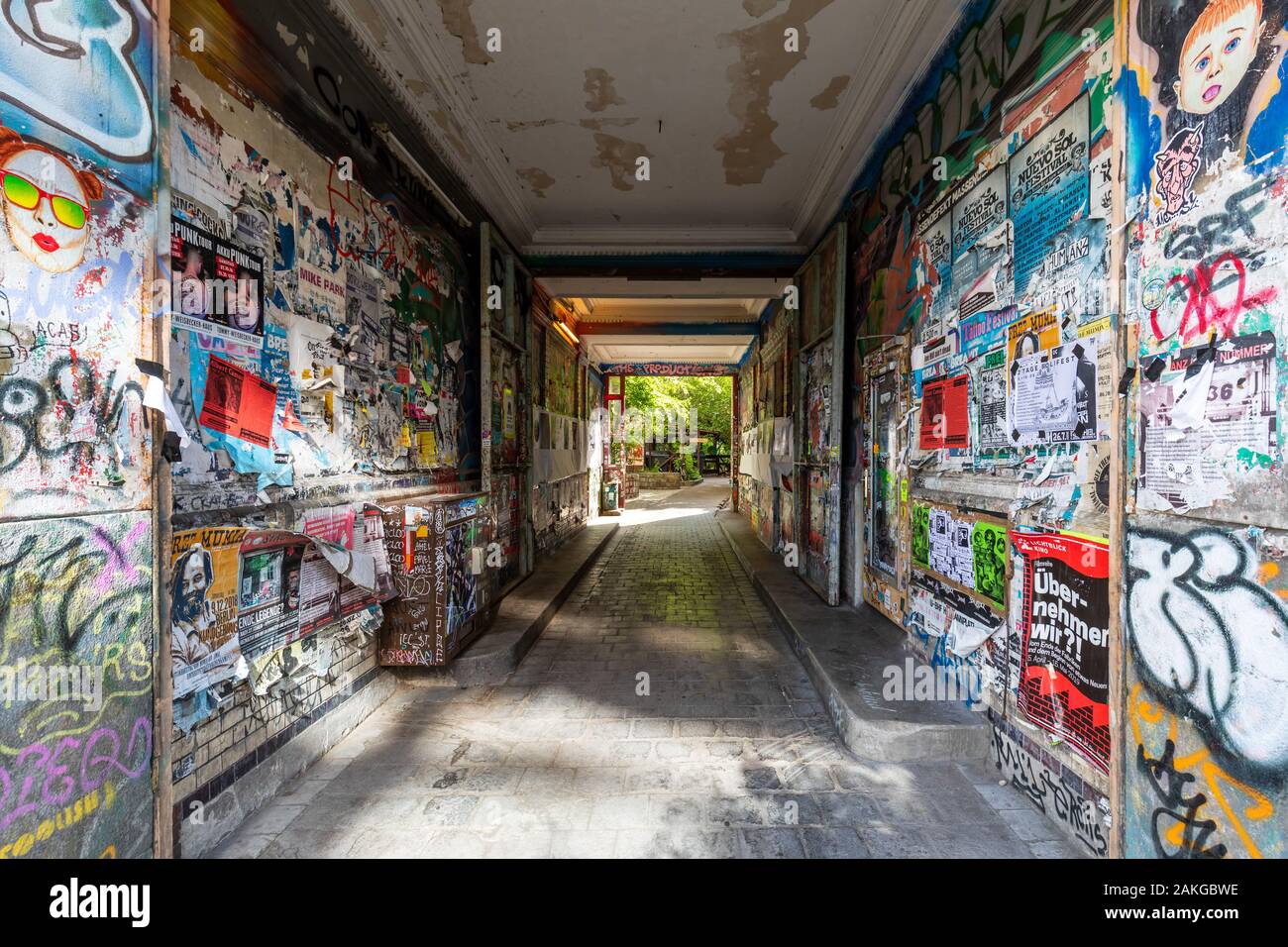Symmetrical view of a community center in Kreuzberg covered with colorful graffiti and ads Stock Photo
