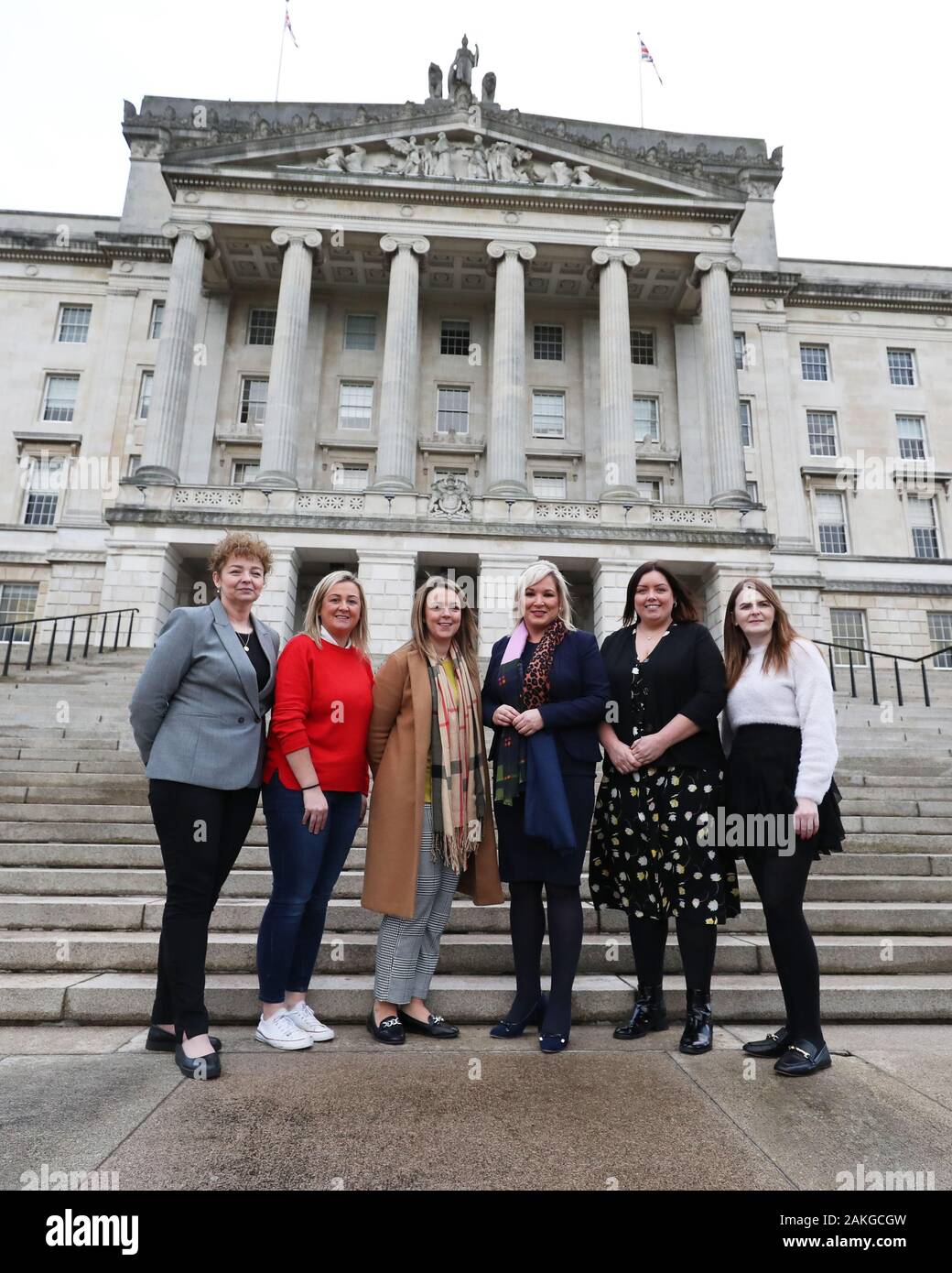 Sinn Fein's Caral Ni Chuilin (far left), Sinad Ennis (second left), deputy leader Michelle O'Neill and Caoimhe Archibald (far right) alongside the party's two new co-opted Members of the Legislative Assembly (MLA) Liz Kimmins (third from left) and Deirdre Hargey (second Right) outside the Stormont Parliament buildings in Belfast, as the deadline approaches for the resumption of a power sharing assembly in Northern Ireland. Stock Photo
