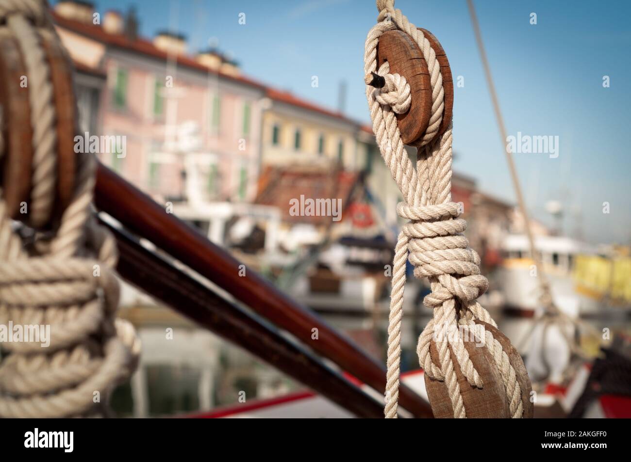 close up view of a old vintage pulley system with rigging ropes on a sailboat in Cesenatico, Italy Stock Photo