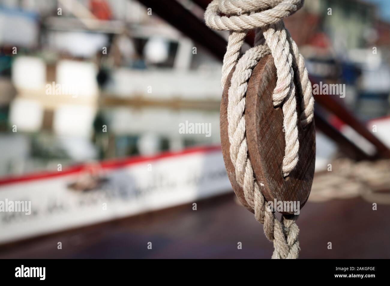 close up view of a old vintage pulley system with rigging ropes on a sailboat in Cesenatico, Italy Stock Photo