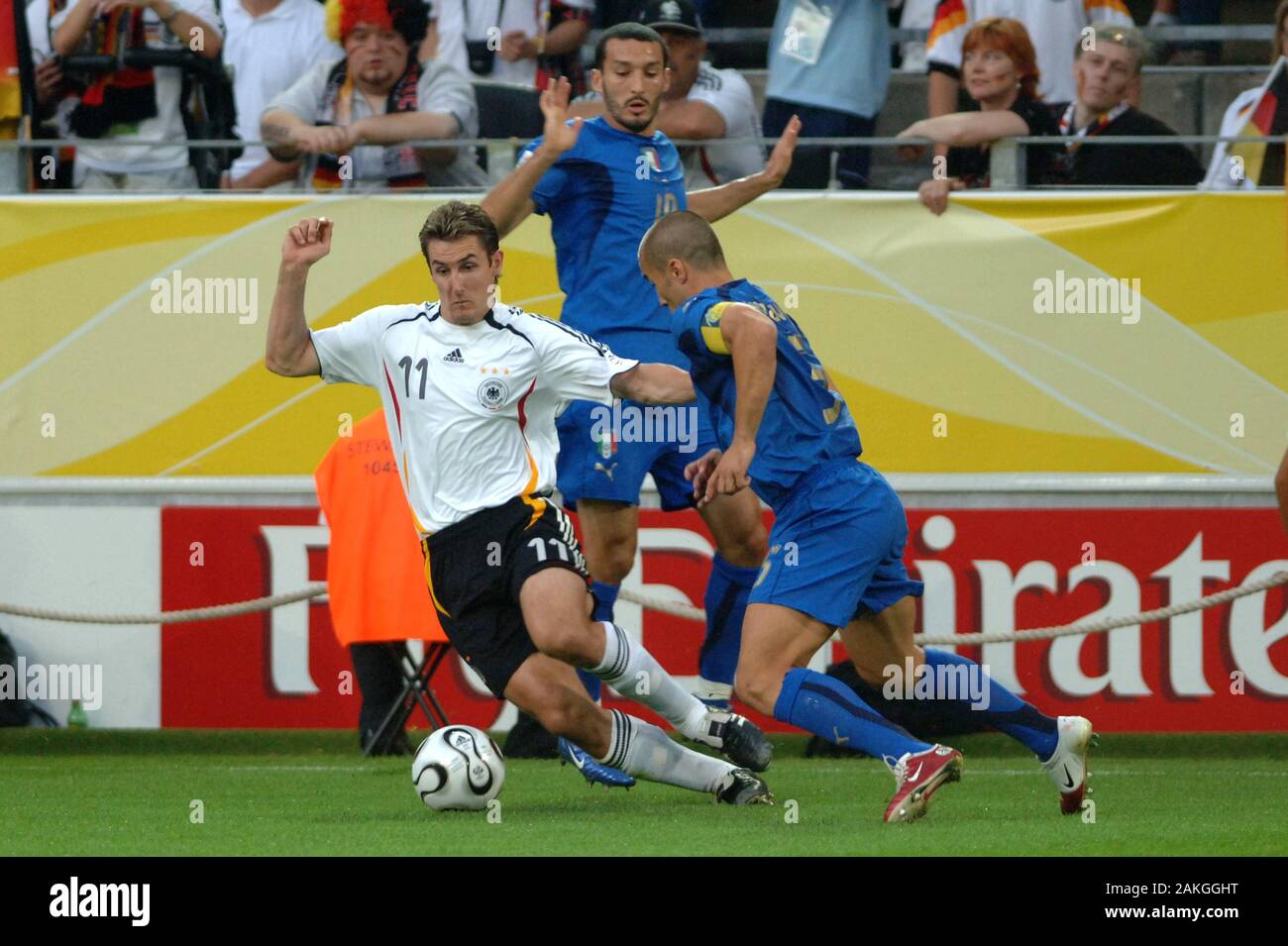 Dortmund Germany, 4 July 2006, FIFA World Cup Germany 2006, Germany-Italy semi-final at the Westfalenstadion: Miroslav Klose and Fabio Cannavaro in action during the  match Stock Photo