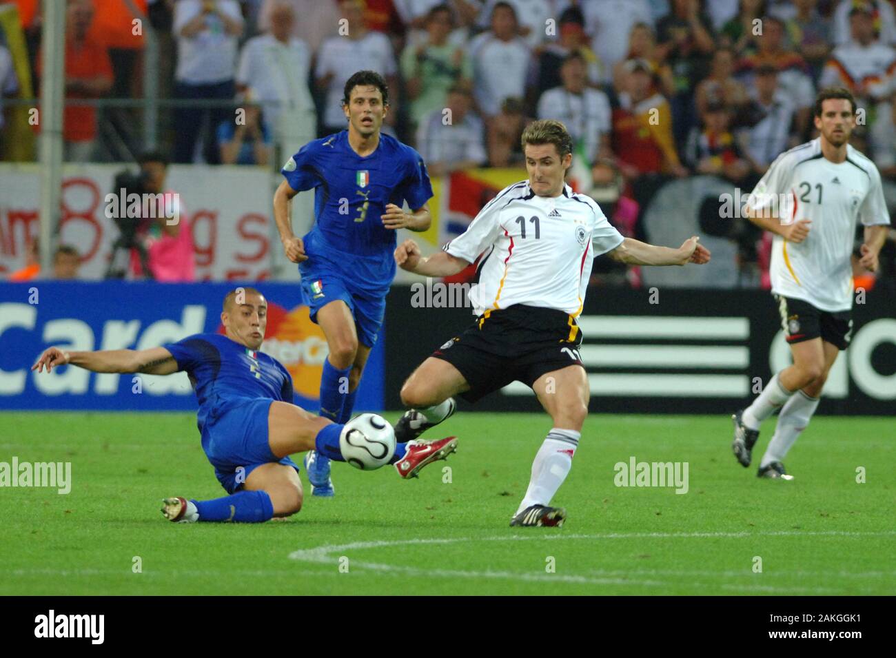 Dortmund Germany, 4 July 2006, FIFA World Cup Germany 2006, Germany-Italy semi-final at the Westfalenstadion: Miroslav Klose and Fabio Cannavaro in action during the  match Stock Photo