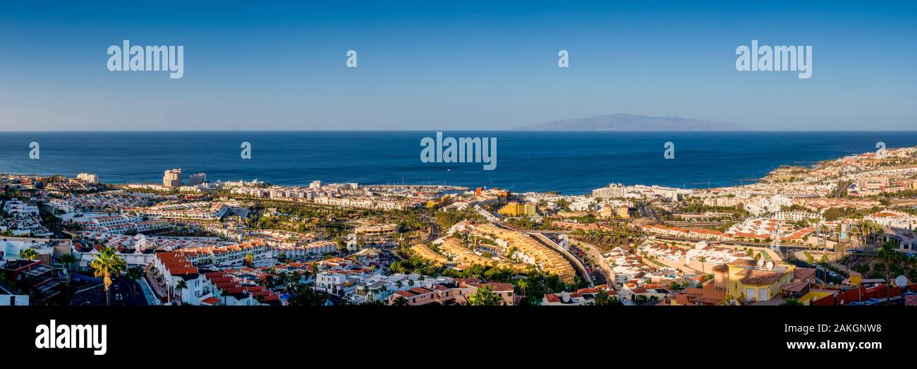 Spain, Canary Islands, Tenerife Island, Playa de Las Americas, elevated resort view with La Gomera Island, dawn Stock Photo