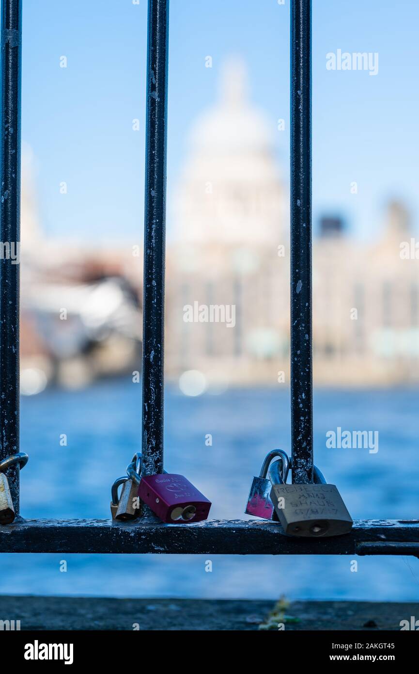 Looking at St Pauls Cathedral and some locks on the fence, London, UK Stock Photo