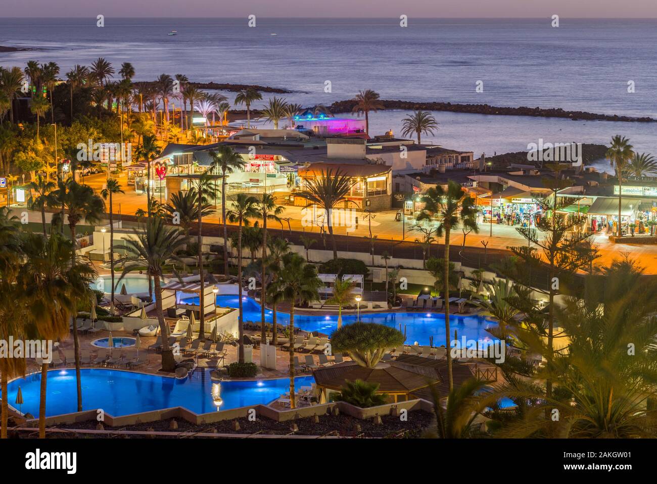 Spain, Canary Islands, Tenerife Island, Playa de Las Americas, resort area, dusk Stock Photo