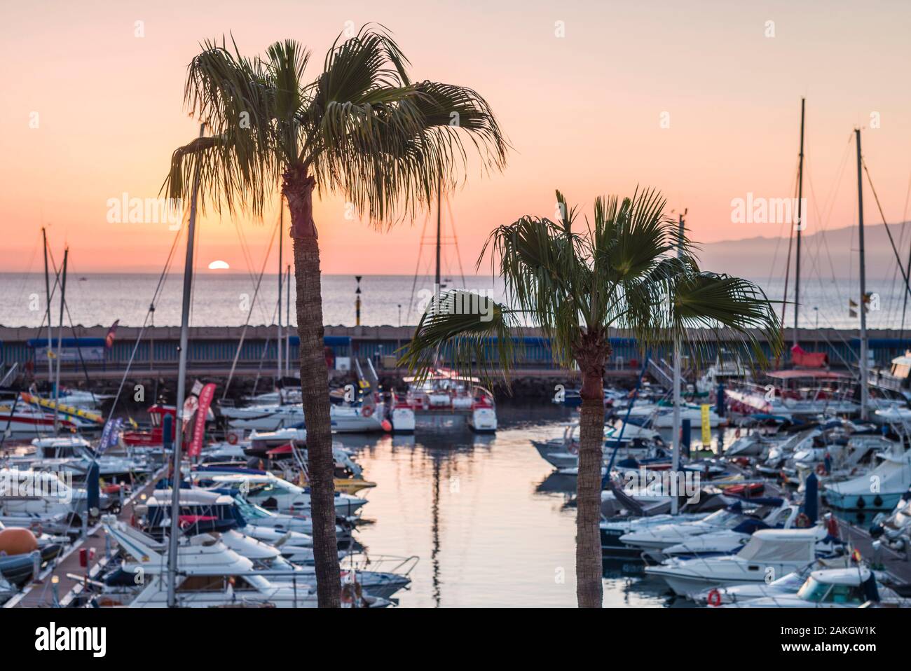 Spain, Canary Islands, Tenerife Island, Playa de Las Americas, Puerto Colon, marina view, sunset Stock Photo