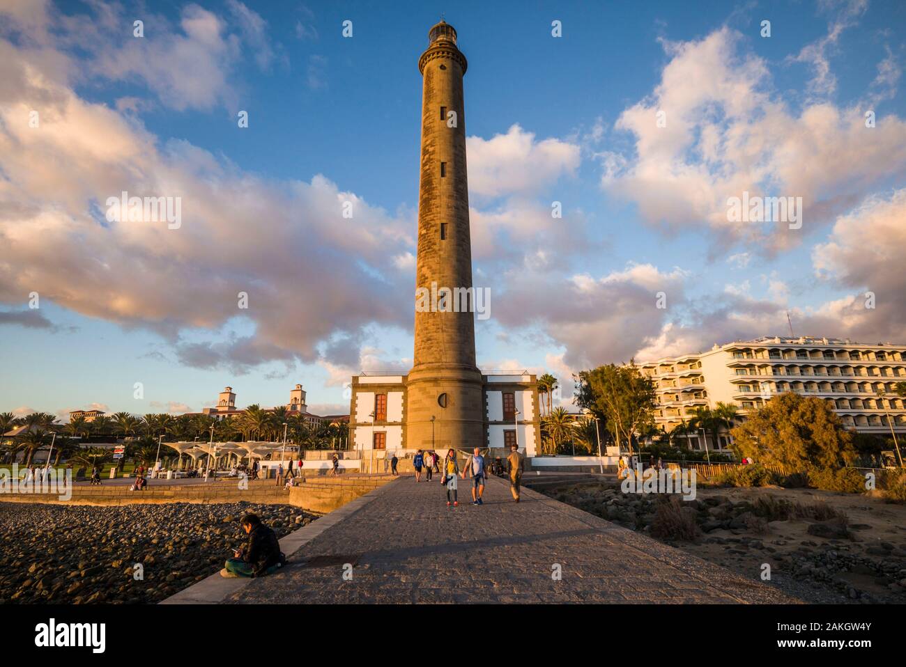Spain, Canary Islands, Gran Canaria Island, Maspalomas, Maspalomas Lighthouse, sunset with visitors Stock Photo