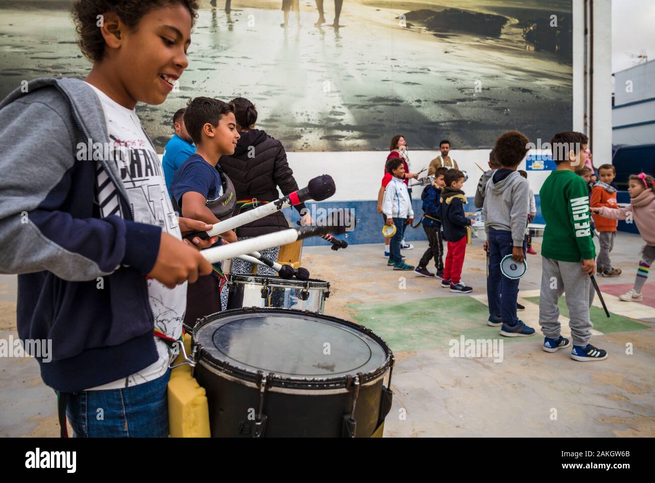 Spain, Canary Islands, Fuerteventura Island, El Cotillo, Fishermans Quarter, children practicing carnival parade drumming Stock Photo