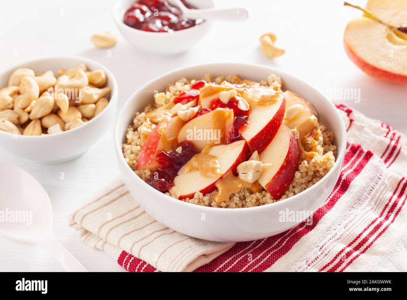 apple peanut butter quinoa bowl with jam and cashew for healthy