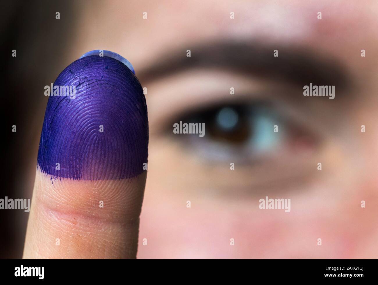 Dresden, Germany. 18th Dec, 2019. A chemist from the Dresden-based ink manufacturer Octopus shows her index finger soaked with choice ink. The special paint on the finger is intended to prevent election fraud, for example in the upcoming elections in Iraq. Credit: Robert Michael/dpa-Zentralbild/ZB/dpa/Alamy Live News Stock Photo