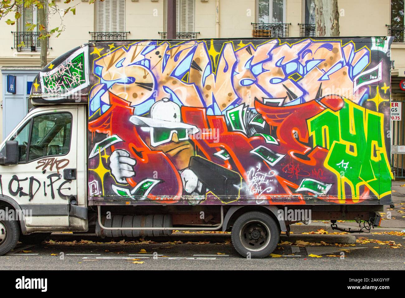 France, Paris, truck tagged in street art Stock Photo