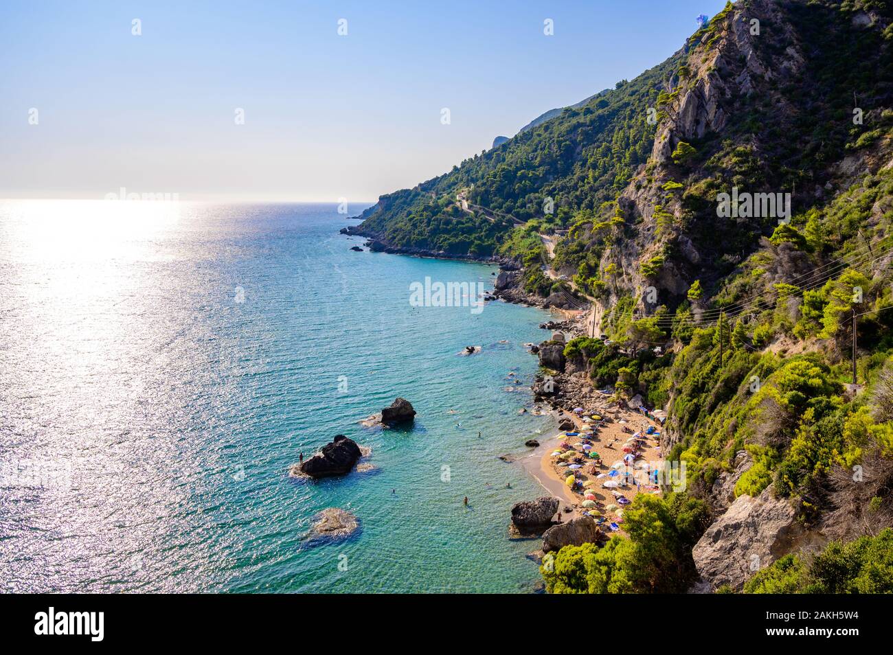 Mirtiotissa beach with crystal clear azure water and white beach in beautiful landscape scenery - paradise coastline of Corfu island close to Glyfada Stock Photo