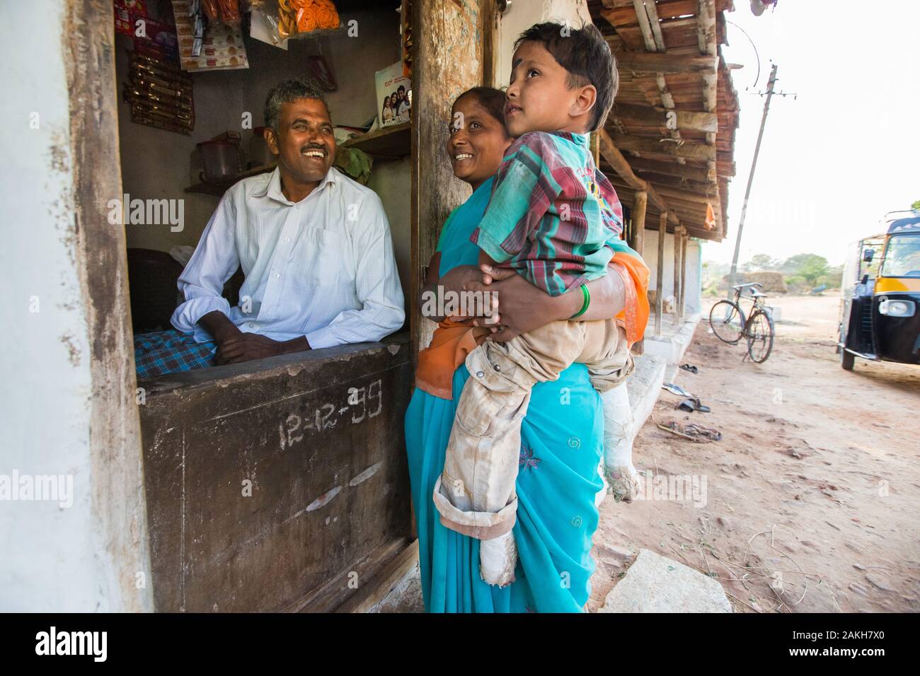 CAPTION: Using a loan from his local self-help group (SHG), Mariswamy has set up a petty shop to help cover the costs associated with his son Manu's c Stock Photo
