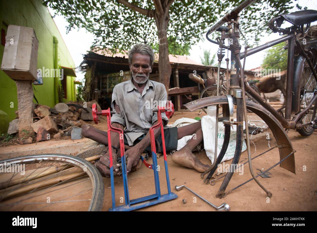 CAPTION: Basavanna has a severe locomotor disability. Loans from the Chamkol programme's Revolving Fund Scheme have helped to ensure that he can suppo Stock Photo