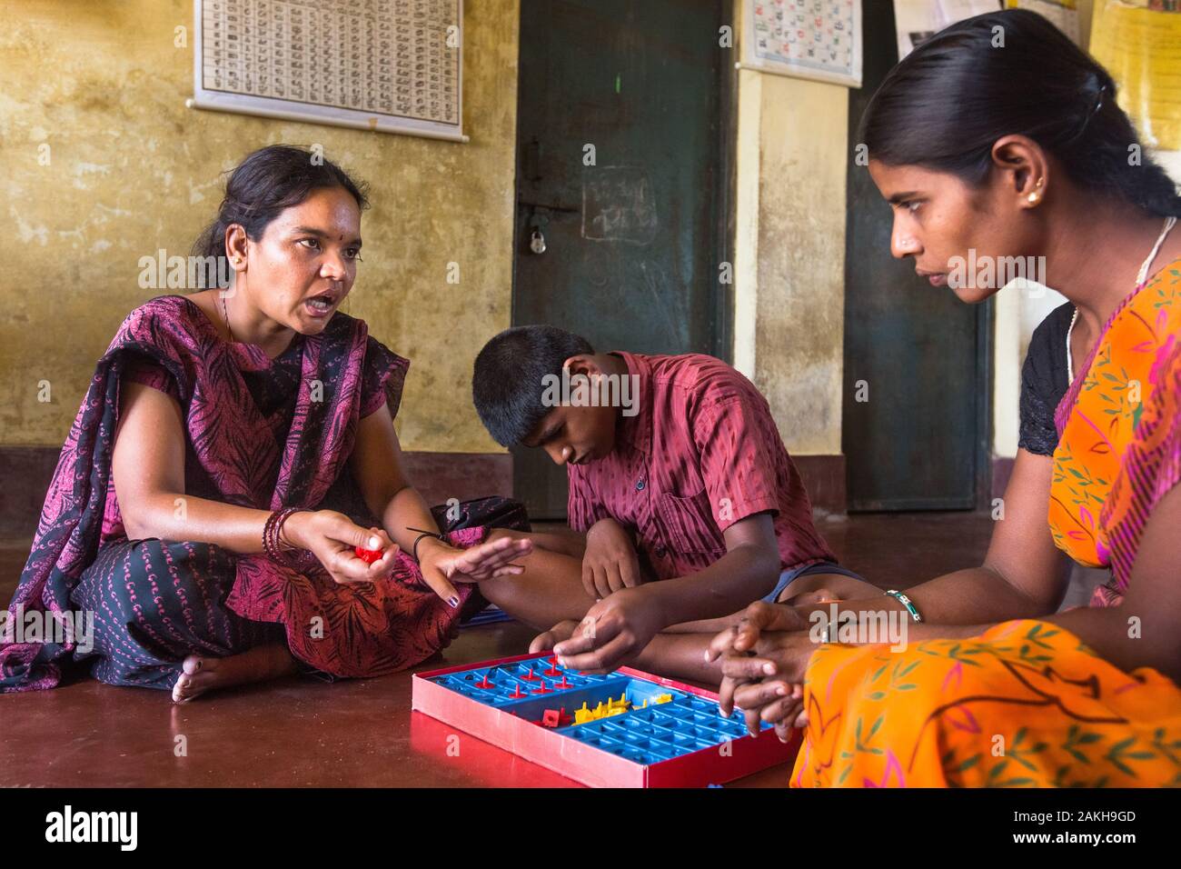 CAPTION: Mobility India's Sudhamani R. trains Drakshayani in the skills she'll need as an After-School Club (ASC) Coordinator. LOCATION: Handrakalli M Stock Photo