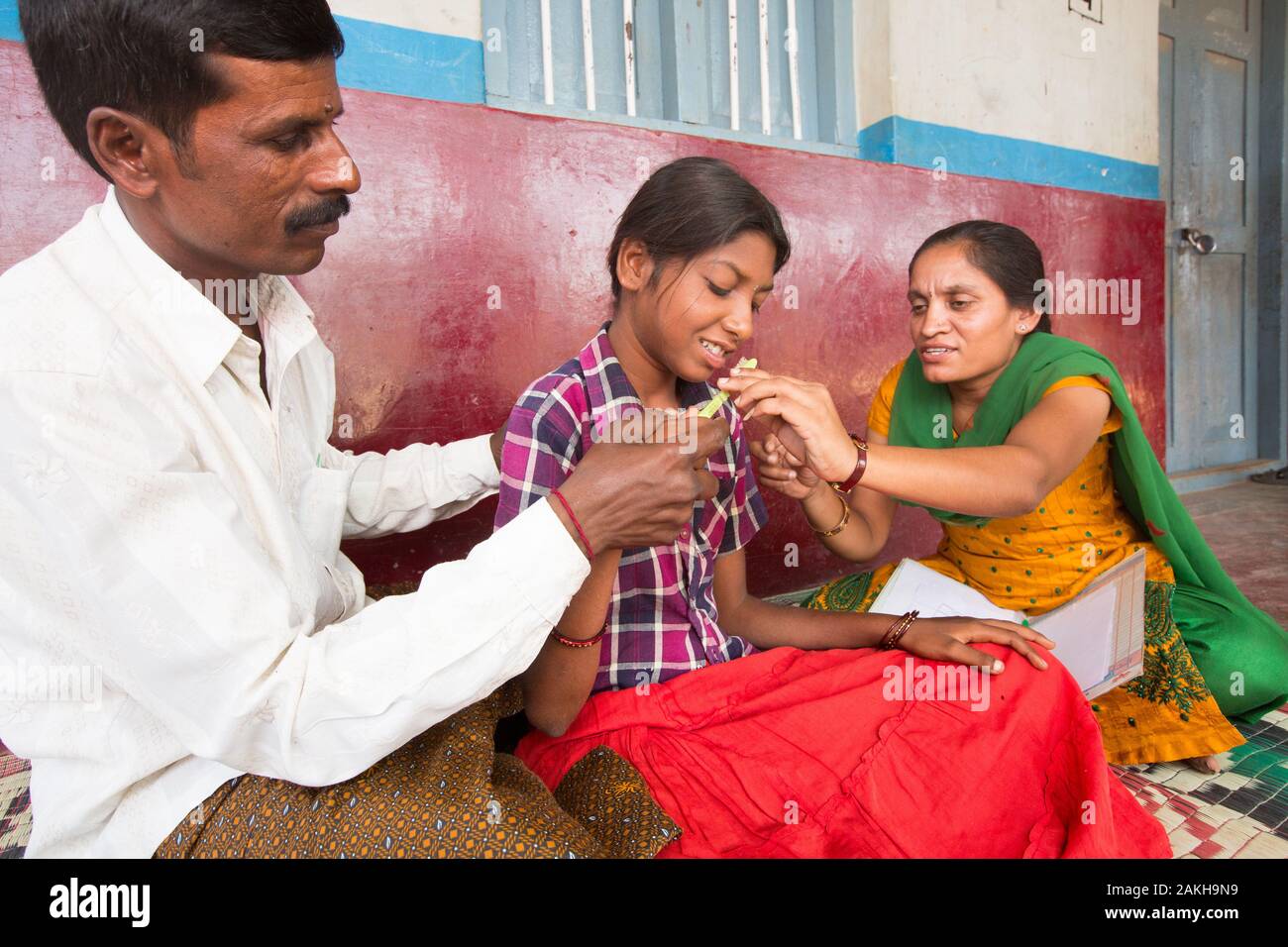 CAPTION: Madhushree has a profound learning disability. Chinnaswamy and his family are determined that in spite of this, she should be able to enjoy a Stock Photo