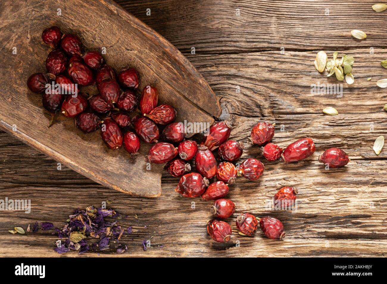 Dried rose hips on a rustic background, top view Stock Photo