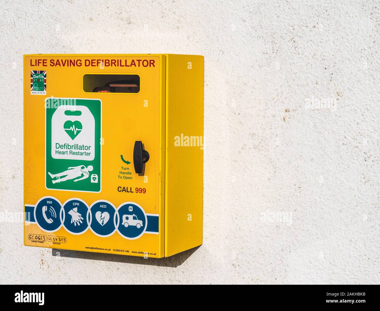 A public access defibrillator fixed to a wall. Stock Photo