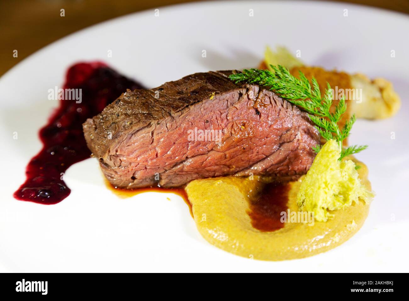 Succulent Austrian roast beef served with pureed vegetables. The meat is  pink Stock Photo - Alamy