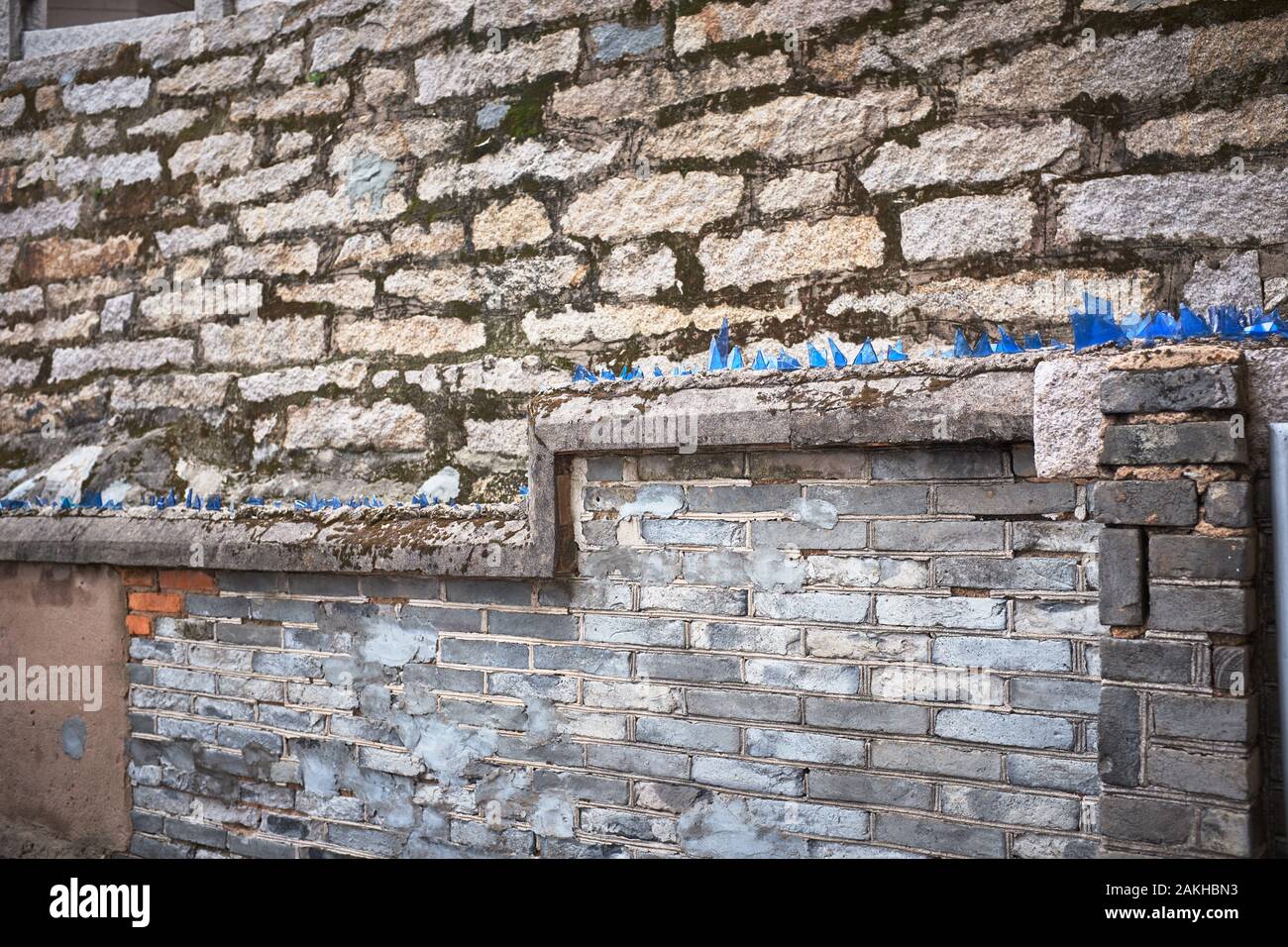Wall with glass shards hires stock photography and images Alamy