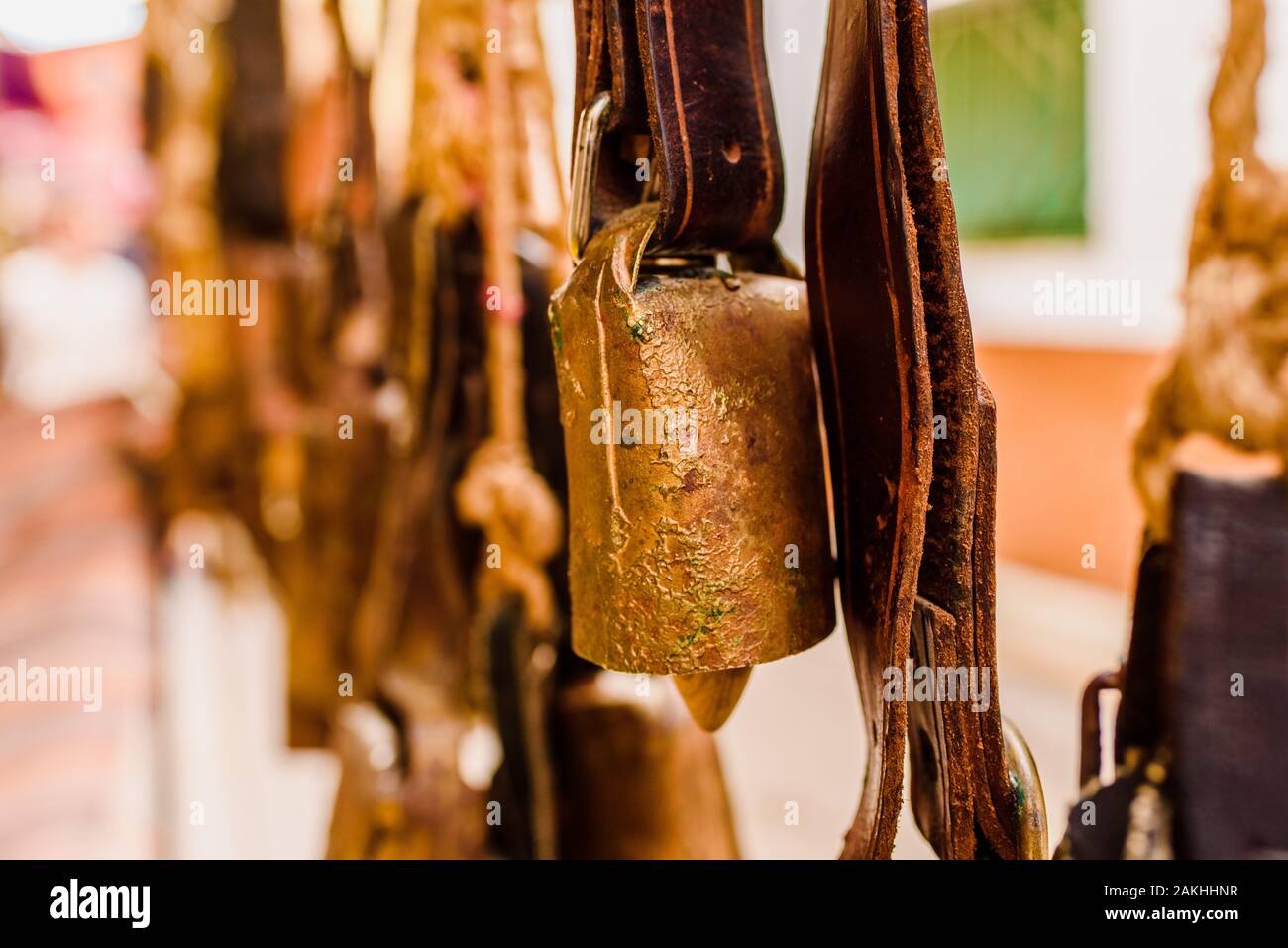 Antique metal cowbells hanging Stock Photo Alamy