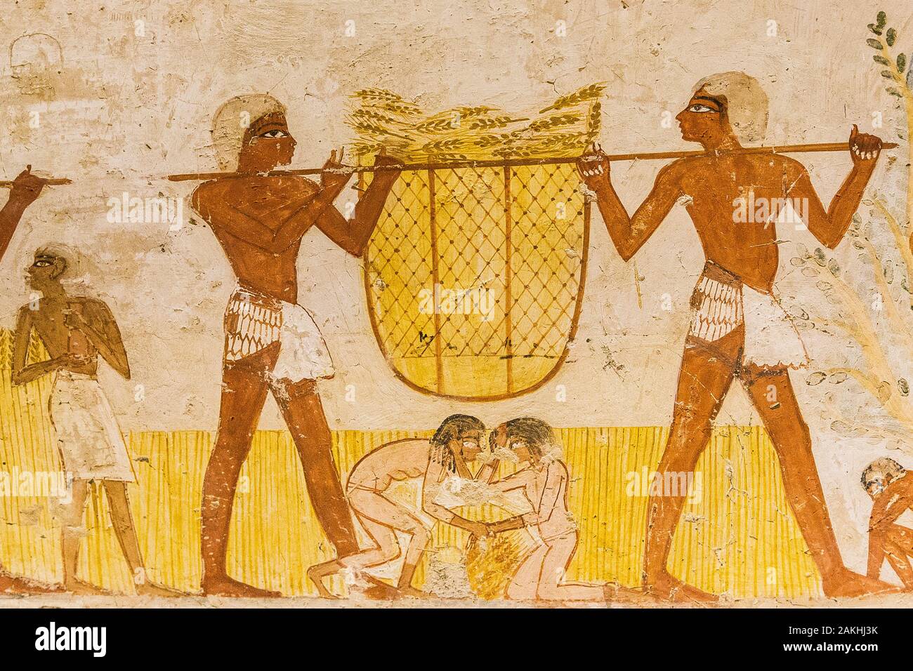 Luxor in Egypt, tomb of Menna. This classical agricultural scene is made more lively by several funny details, like a fight between 2 young girls. Stock Photo
