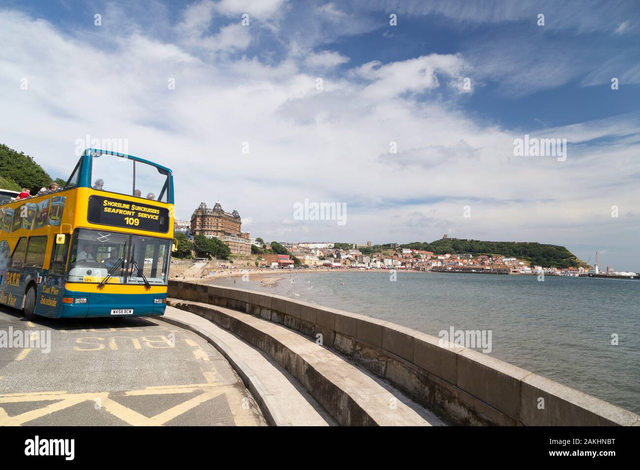 Open topped tourist bus on Scarborough promenade. Stock Photo