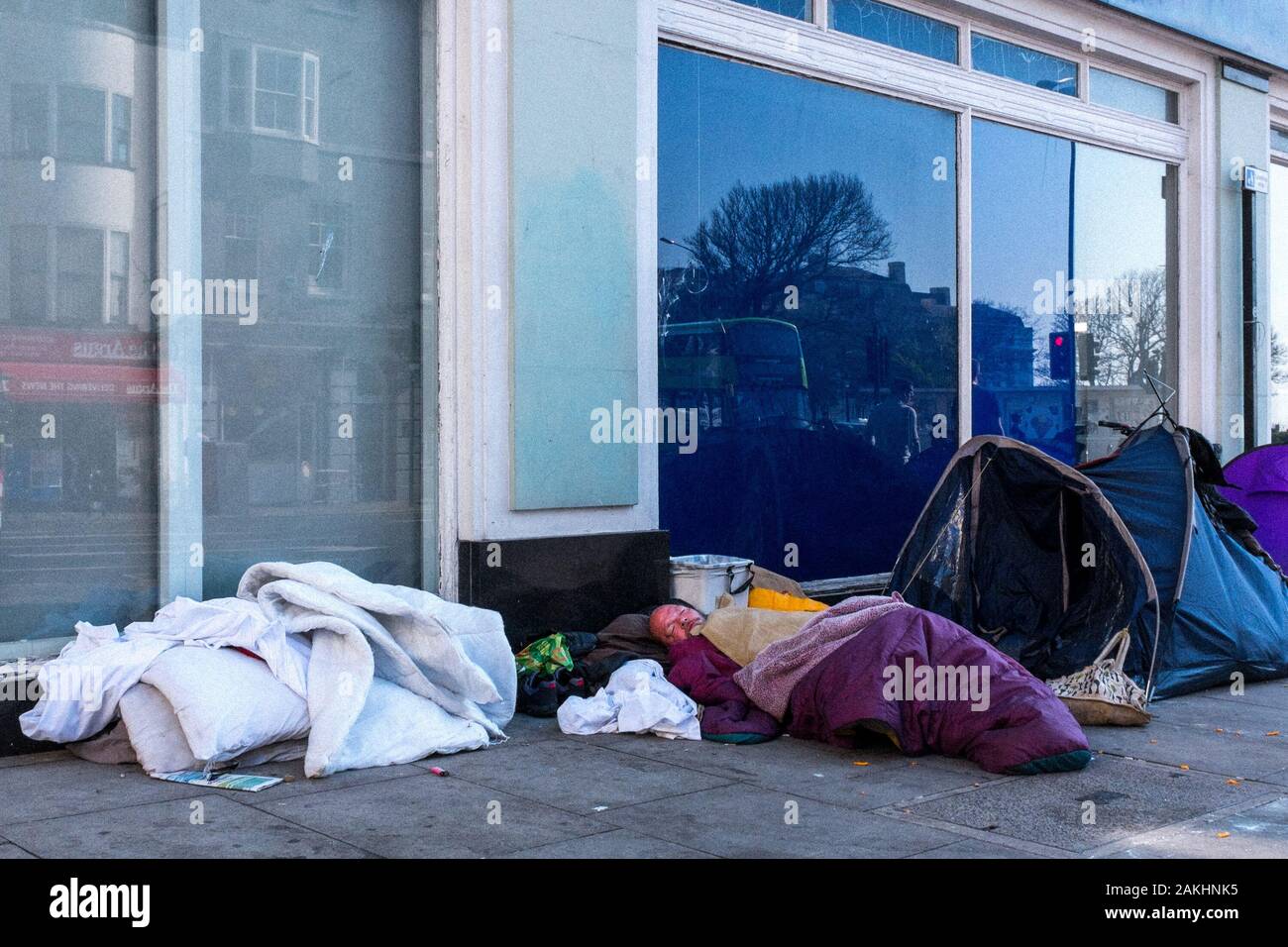 Homeless Man Sleeping On North Street, Brighton, UK Stock Photo - Alamy