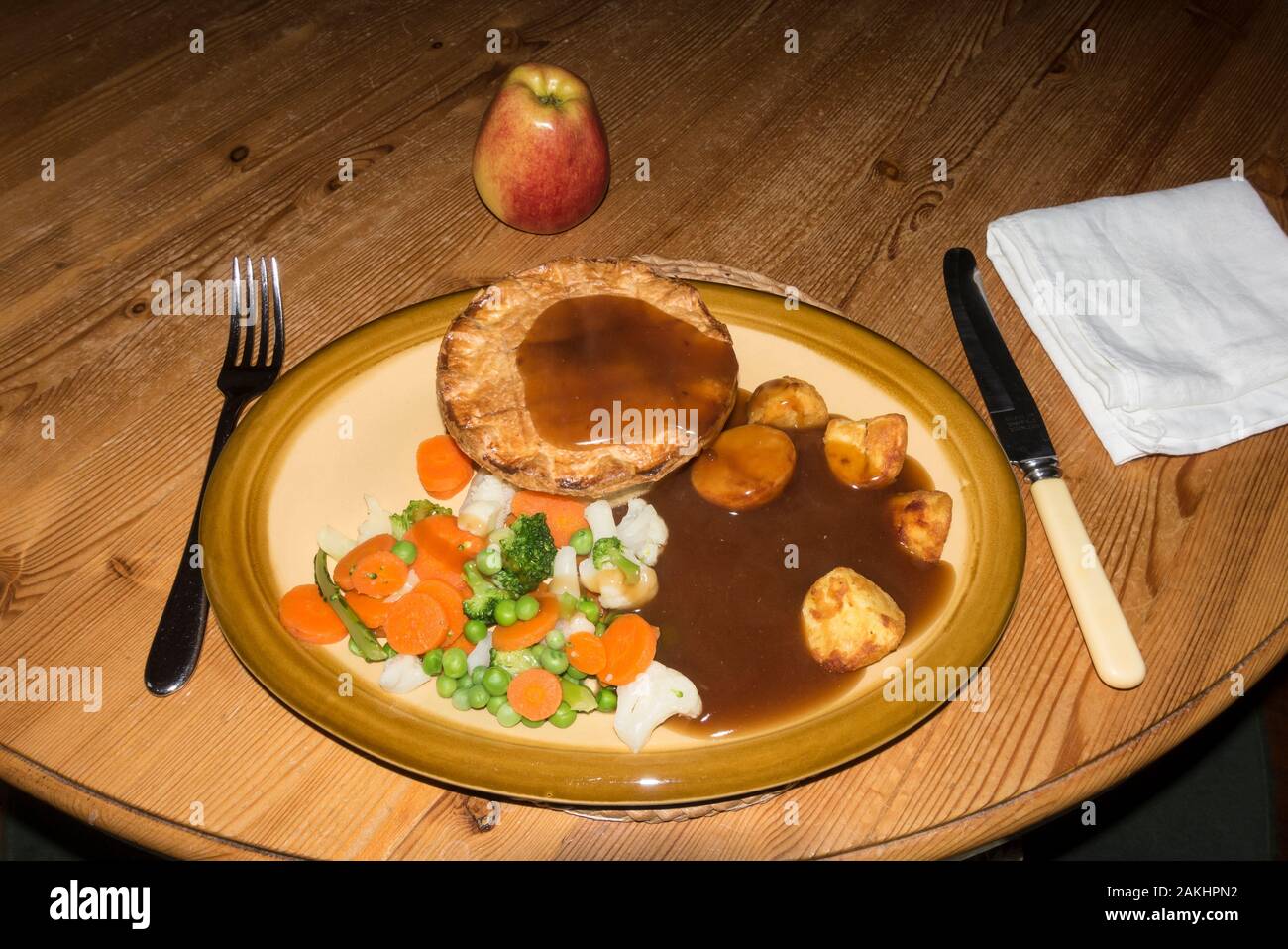 Chicken pie with roast potatoes and mixed veg main course Stock Photo