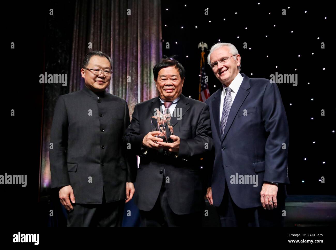 New York, USA. 8th Jan, 2020. Xu Chen, chairman of China General Chamber of Commerce-USA and president and CEO of Bank of China USA, Cao Dewang, chairman and founder of Chinese Fuyao Group and Bob Holden, chairman & CEO of the United States Heartland China Association (from L to R) pose for a photo during the 15th anniversary and Chinese Lunar New Year gala of China General Chamber of Commerce-U.S.A. in New York, the United States, Jan. 8, 2020. Credit: Wang Ying/Xinhua/Alamy Live News Stock Photo