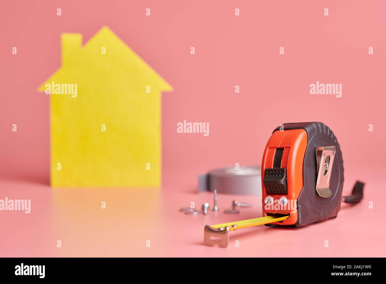 Metal tape measure funny concept. House renovation. Home repair and