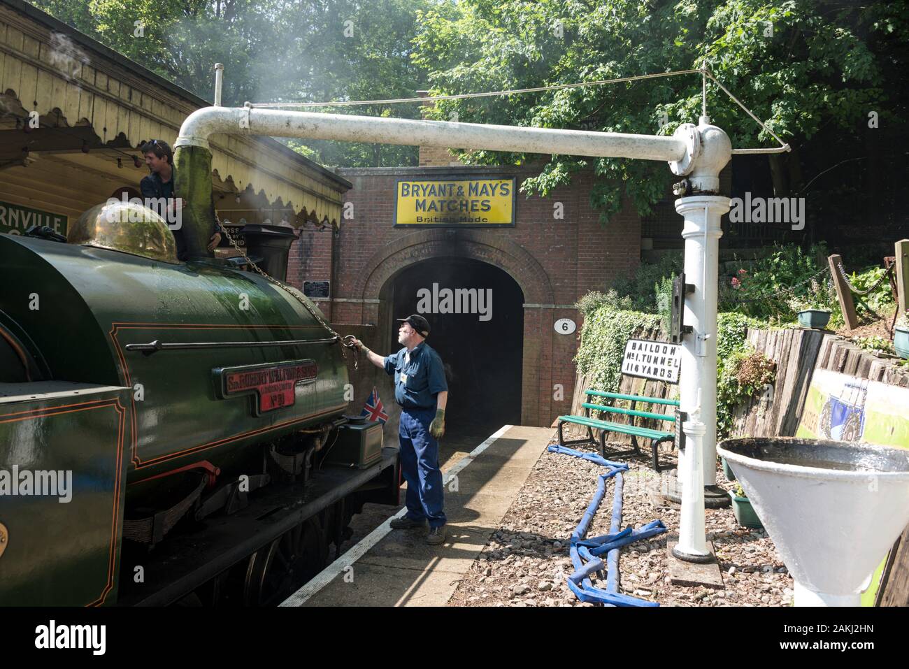 Water is being fed into the steam locomotive by volunteers at the station  on Lord & Lady McAlpine's estate in Fawley Hill near Henley-on-Thames in  Oxf Stock Photo - Alamy