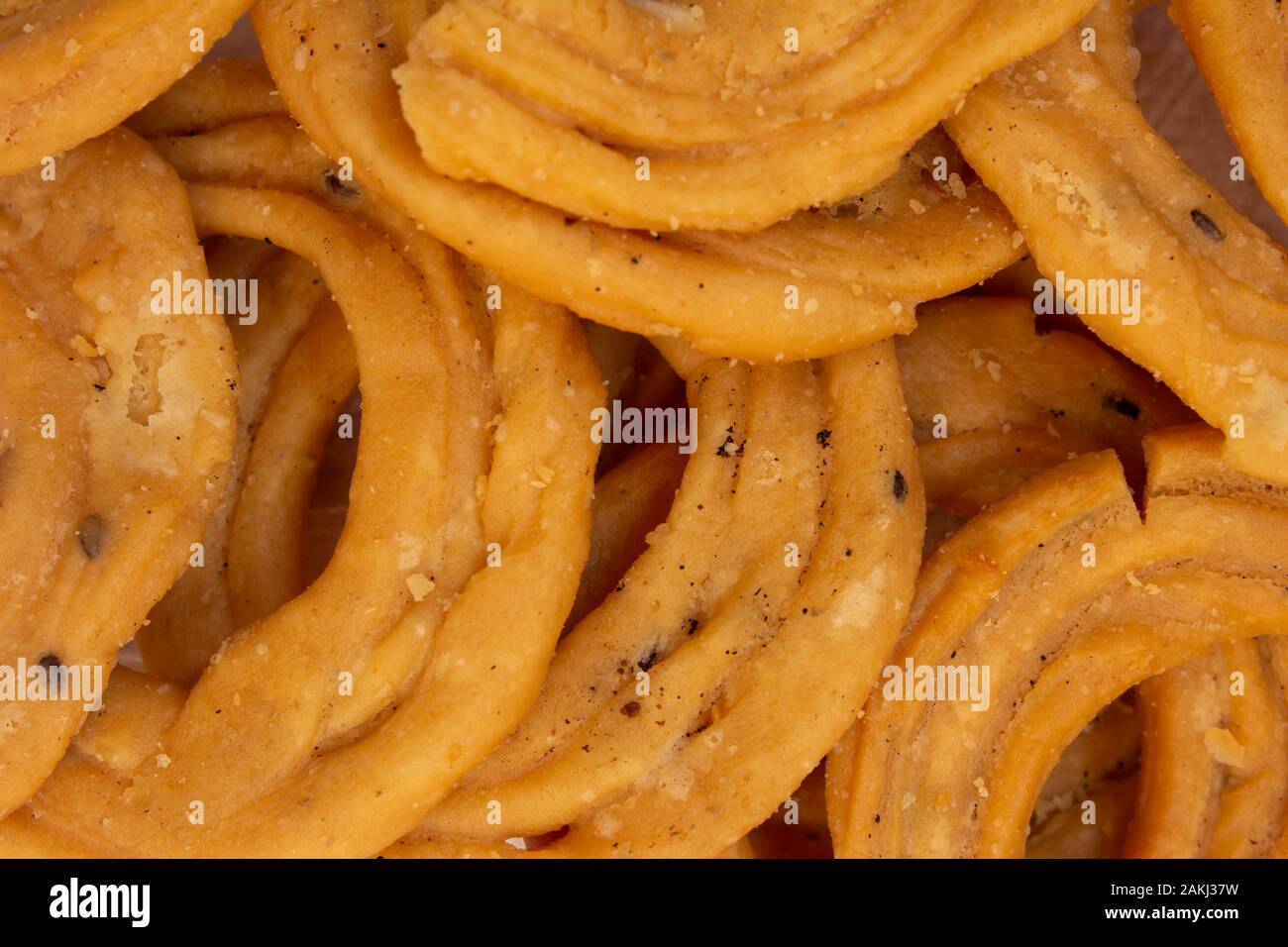 Close view of murukku which is a popular south indian savoury. Indian sweet and savoury prepared during festivals. Stock Photo