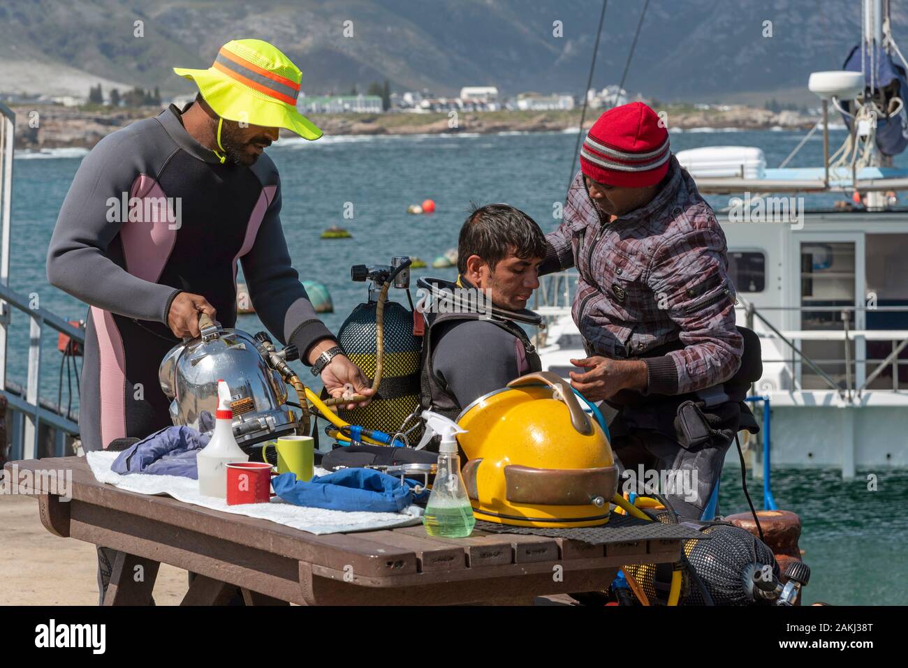 Hermanus, Western cape, South Africa. December 2019. Professional divers training course, Preparing young student diver before going to dive. Stock Photo