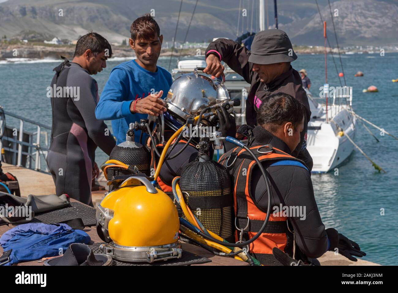 Hermanus, Western cape, South Africa. December 2019. Professional divers training course, Preparing young student diver before going to dive. Stock Photo