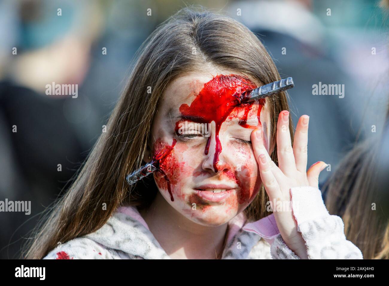 Bristol, UK. 28th Oct, 2017. A woman dressed as a zombie is pictured as she participates in a zombie walk through the city centre. Stock Photo