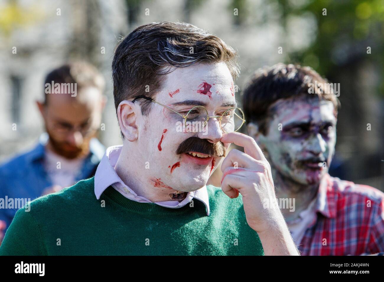 Bristol, UK. 28th Oct, 2017. A man dressed as a zombie is pictured as he participates in a zombie walk through the city centre. Stock Photo