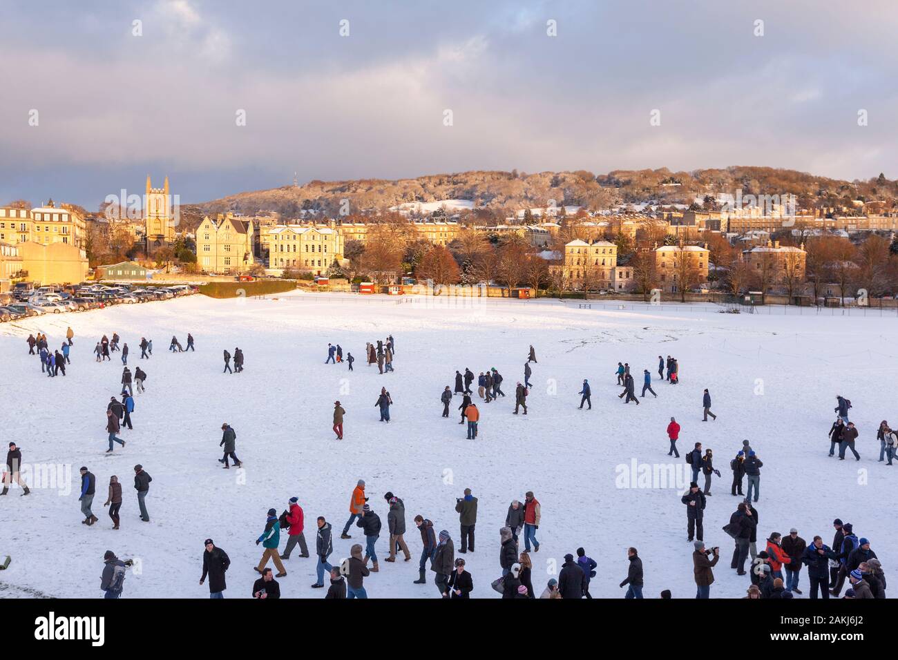 BATH, UNITED KINGDOM - DECEMBER 18, 2010 : Wide view of people on the snowy field at Bath Recreation Ground on a winter's day. Stock Photo