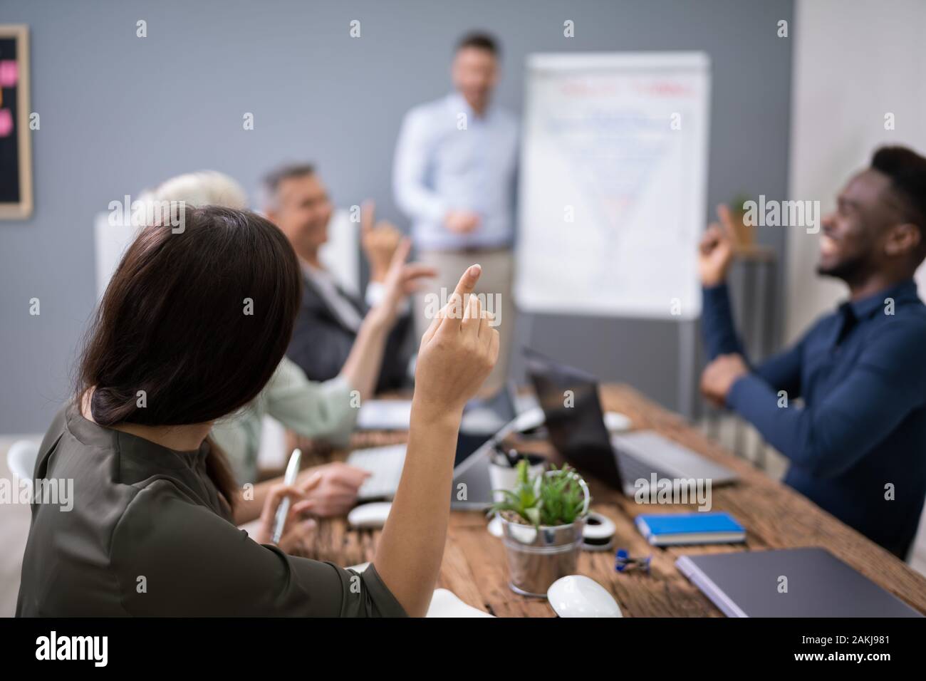 Group Of Successful Business People At The Lecture Asking Questions