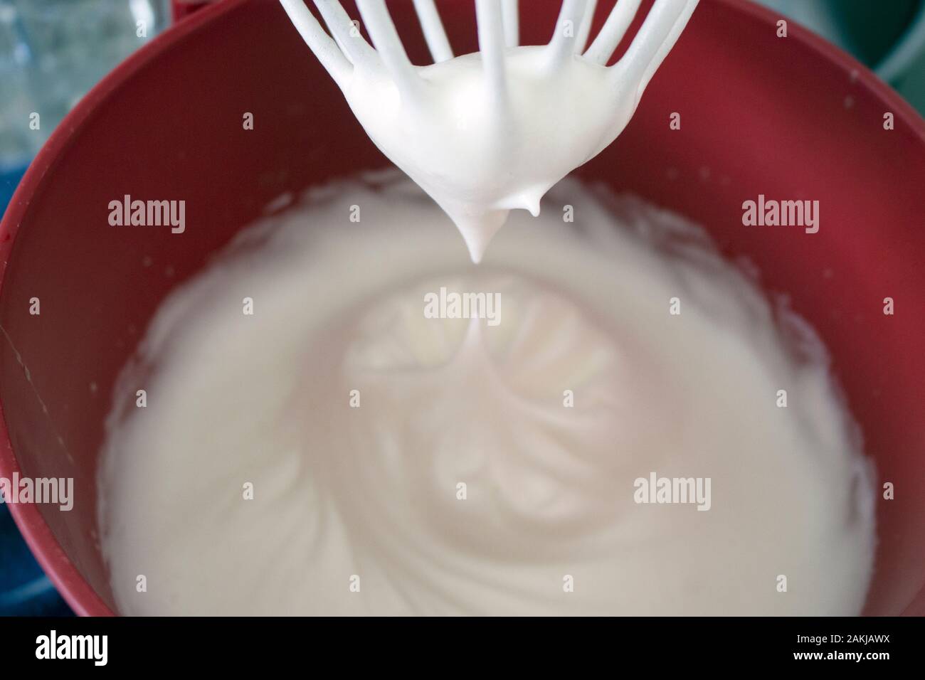Egg whites beaten in snow, to become an ingredient in sweet and savory dishes Stock Photo