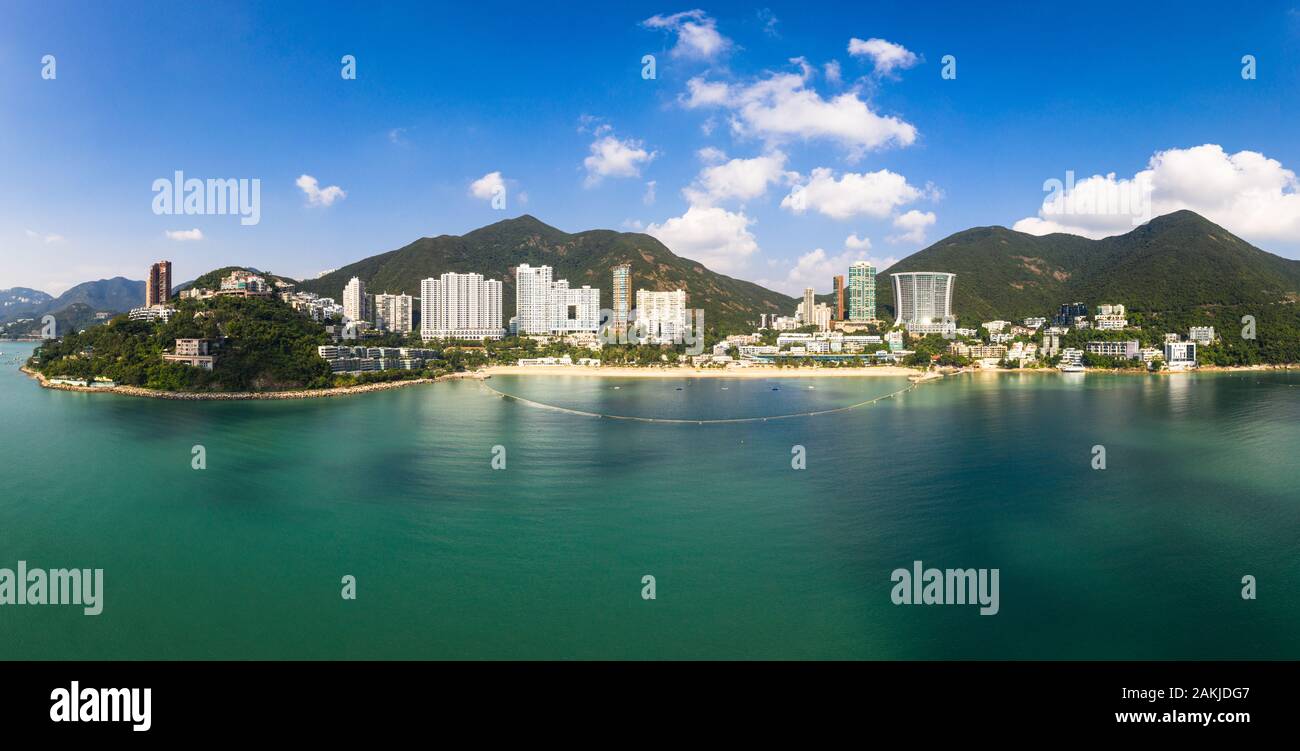 Aerial panorama of the Repusle bay beach in Hong Kong island on a sunny day. Repulse bay is a very popular escape from the big city Stock Photo