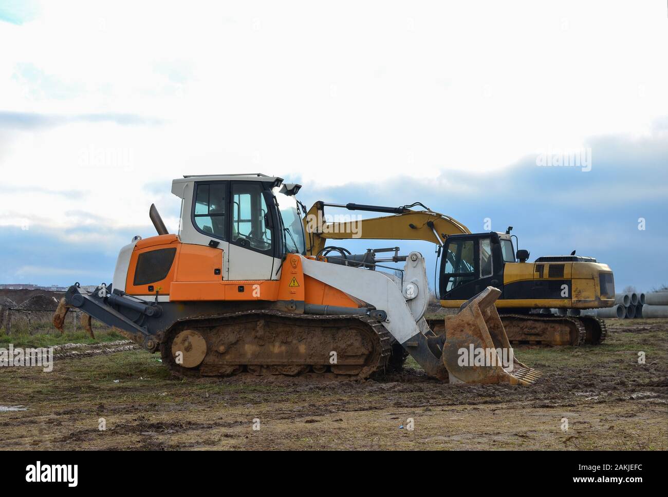Crawler Loader and excavator at construction site. Land clearing