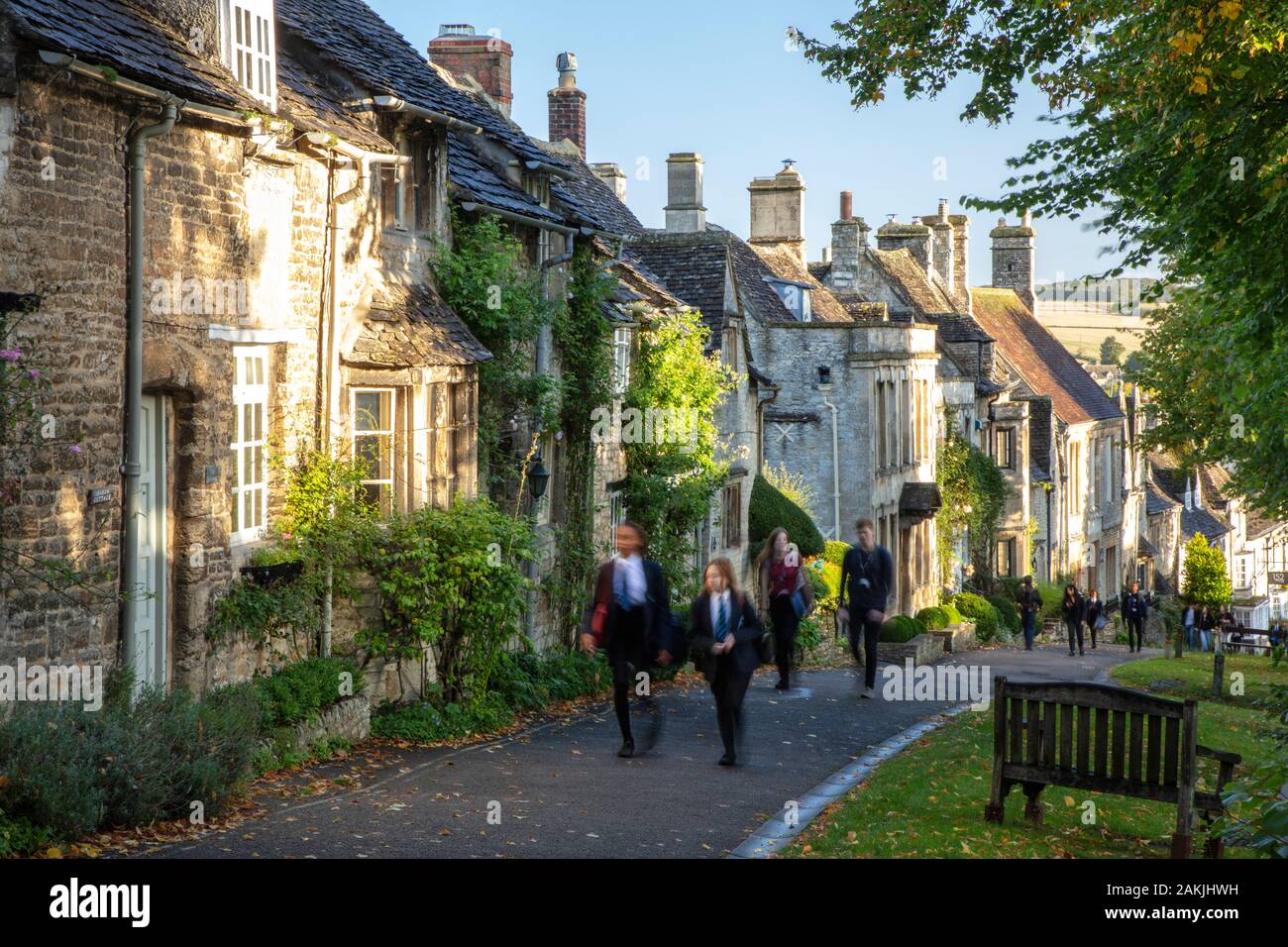 School children walking up The Hill to school past rows of homes in