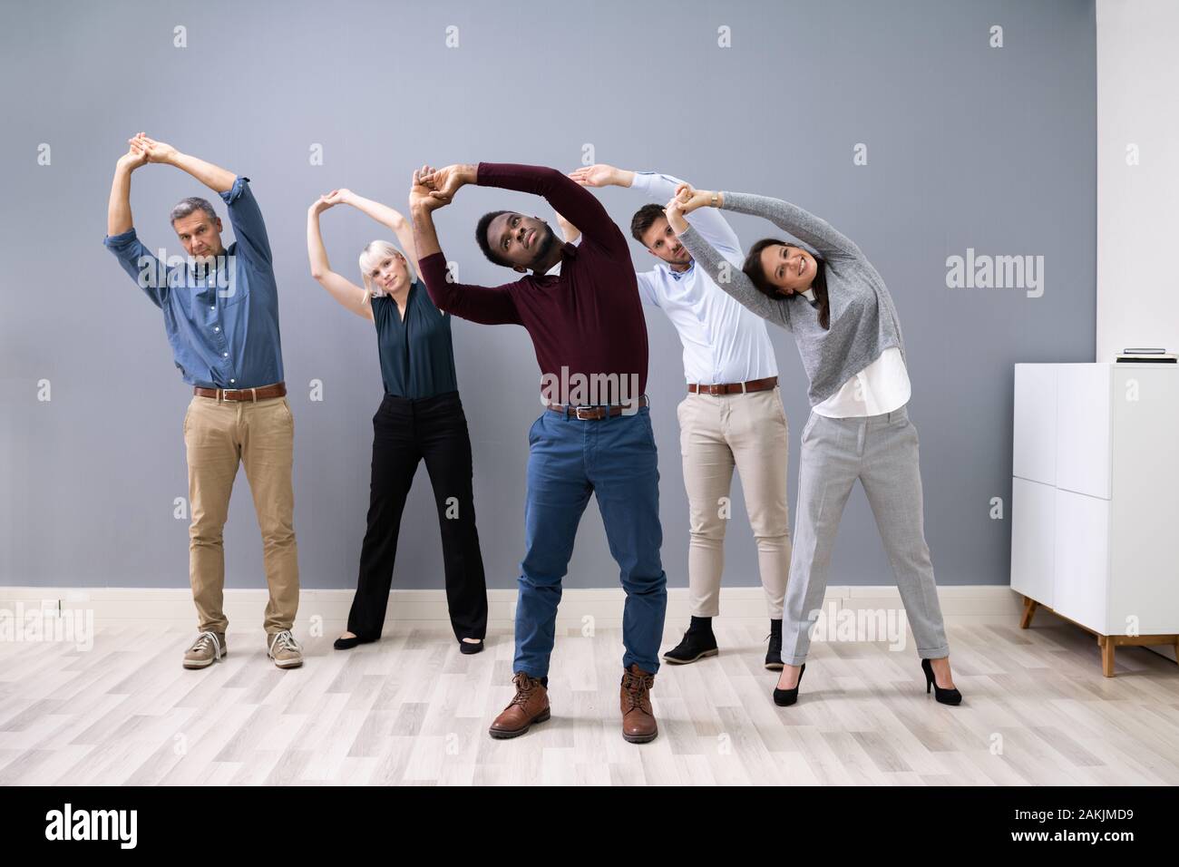 Diverse group people doing stretching hi-res stock photography and ...