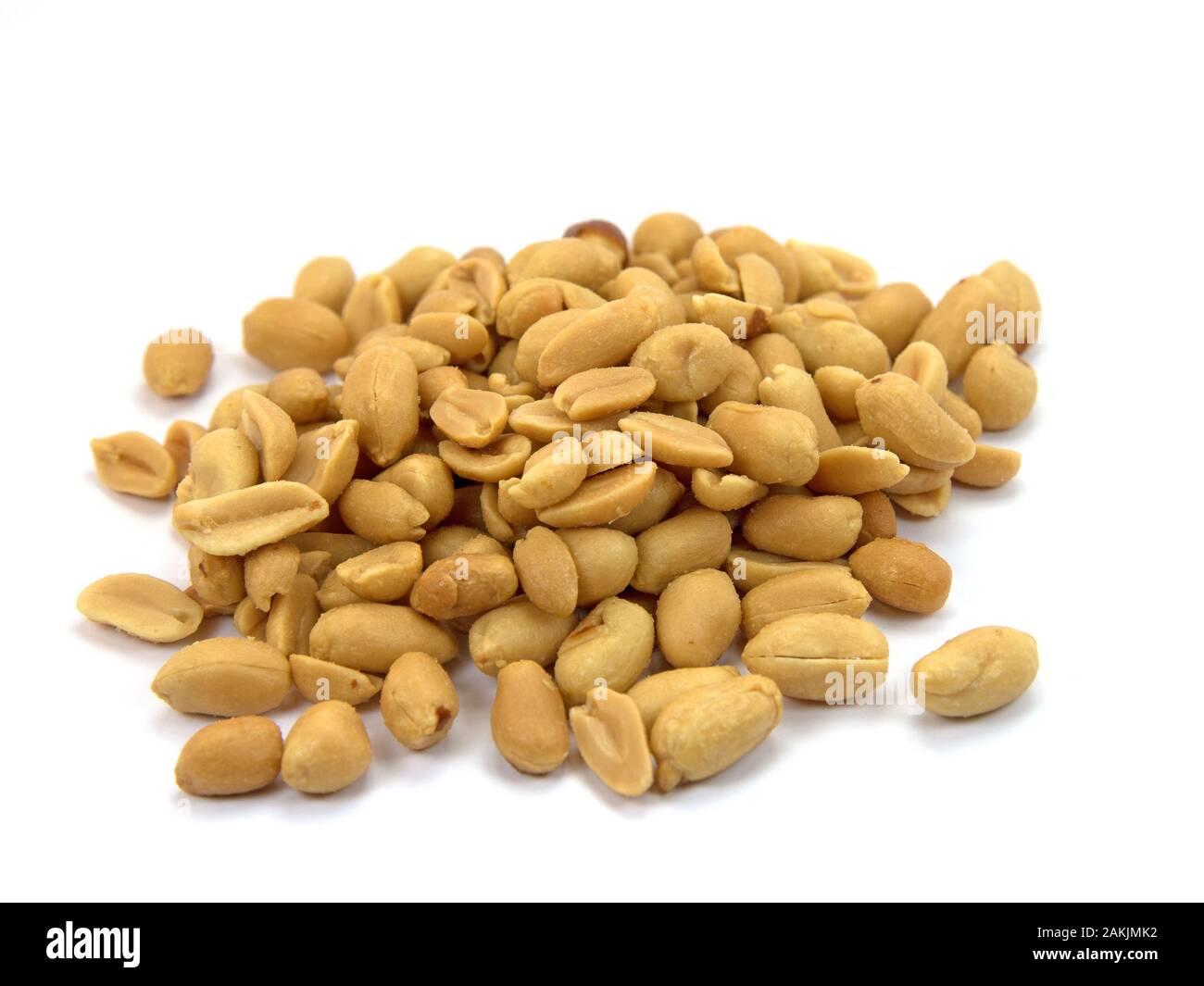 Roasted and salted peanuts against a white background Stock Photo