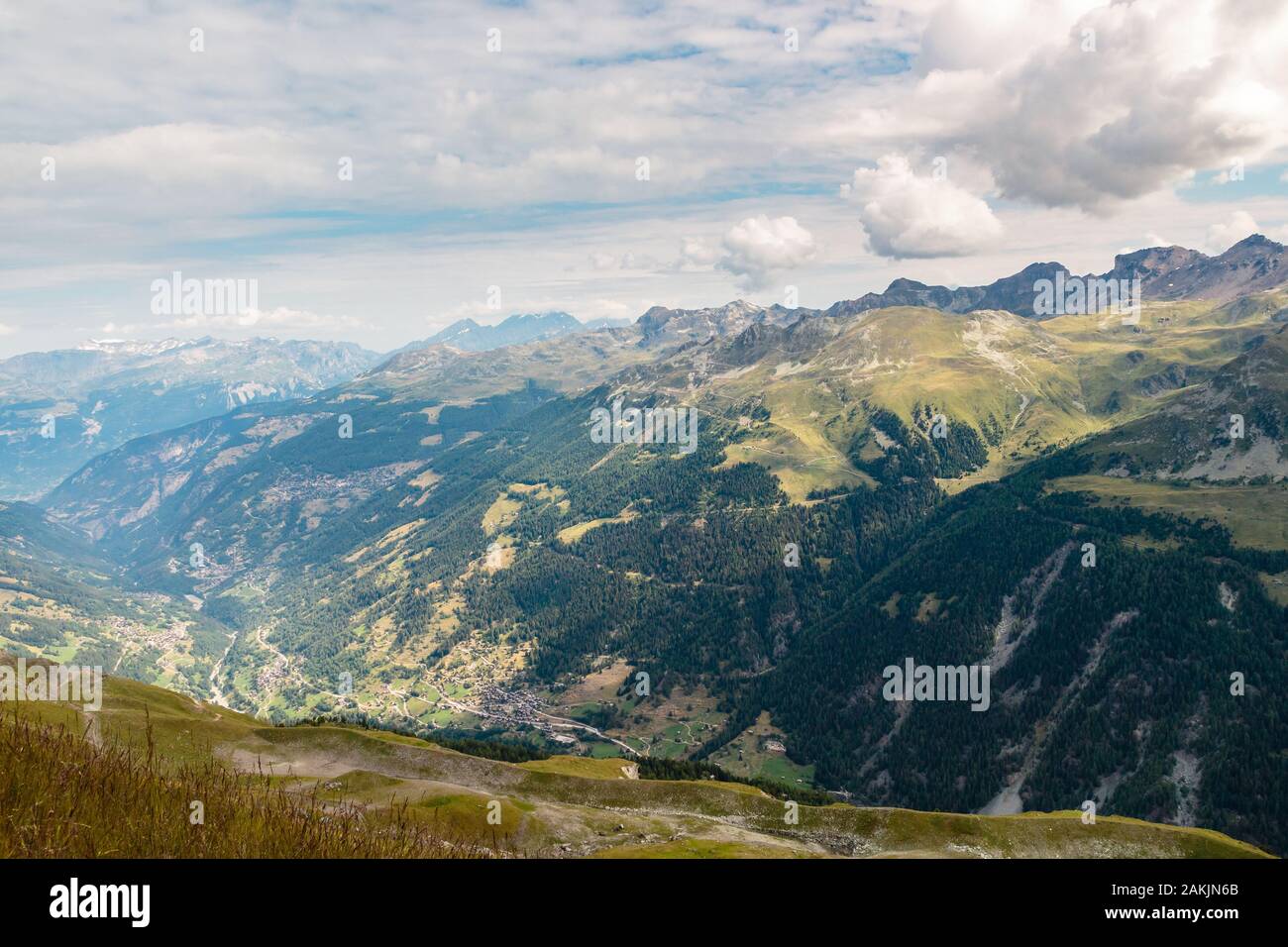 Beautiful high angle view on the Anniviers valley with some picturesque alpine villages seen from top of Sorebois on a cloudy summer day. Zinal, Val d Stock Photo